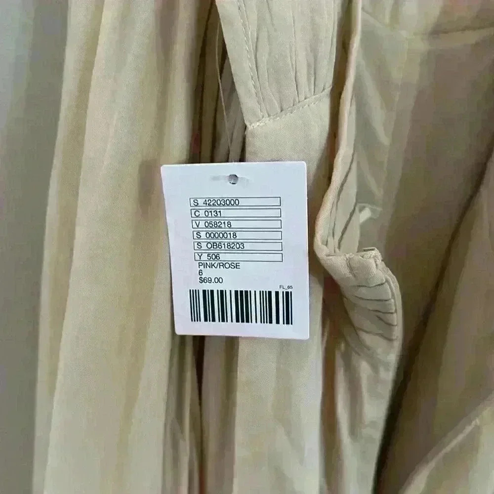 NWT Tan romper with a criss crossed open back - Picture 16 of 16